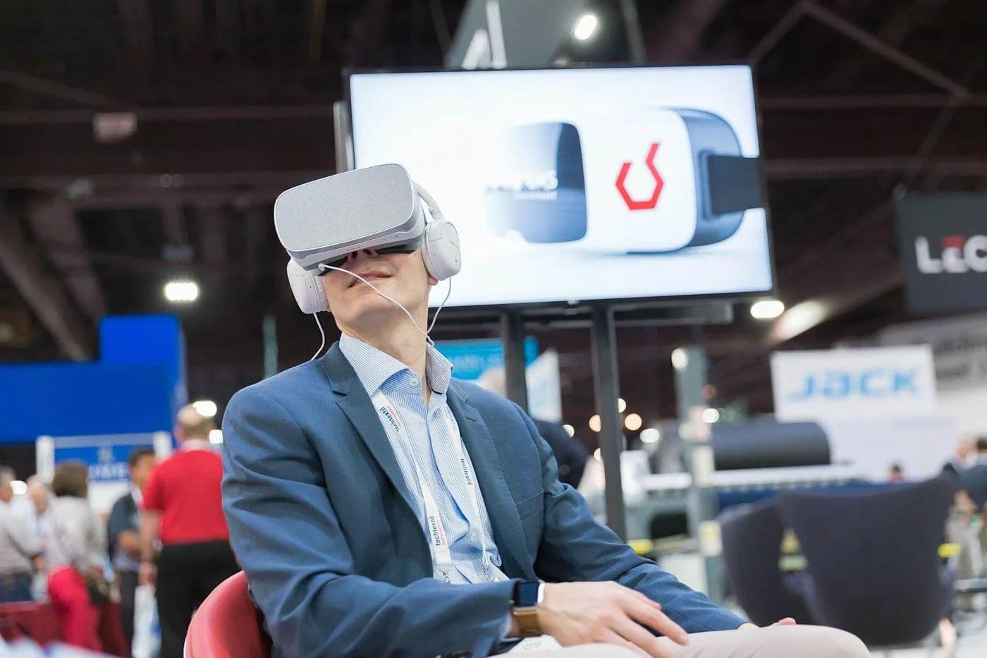 A visitor trying the Eton Systems VR experience at a trade show