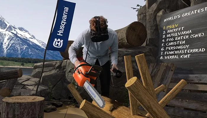 A player wearing a VR headset and using the Limberjack chainsaw controller in the mountain logging arena