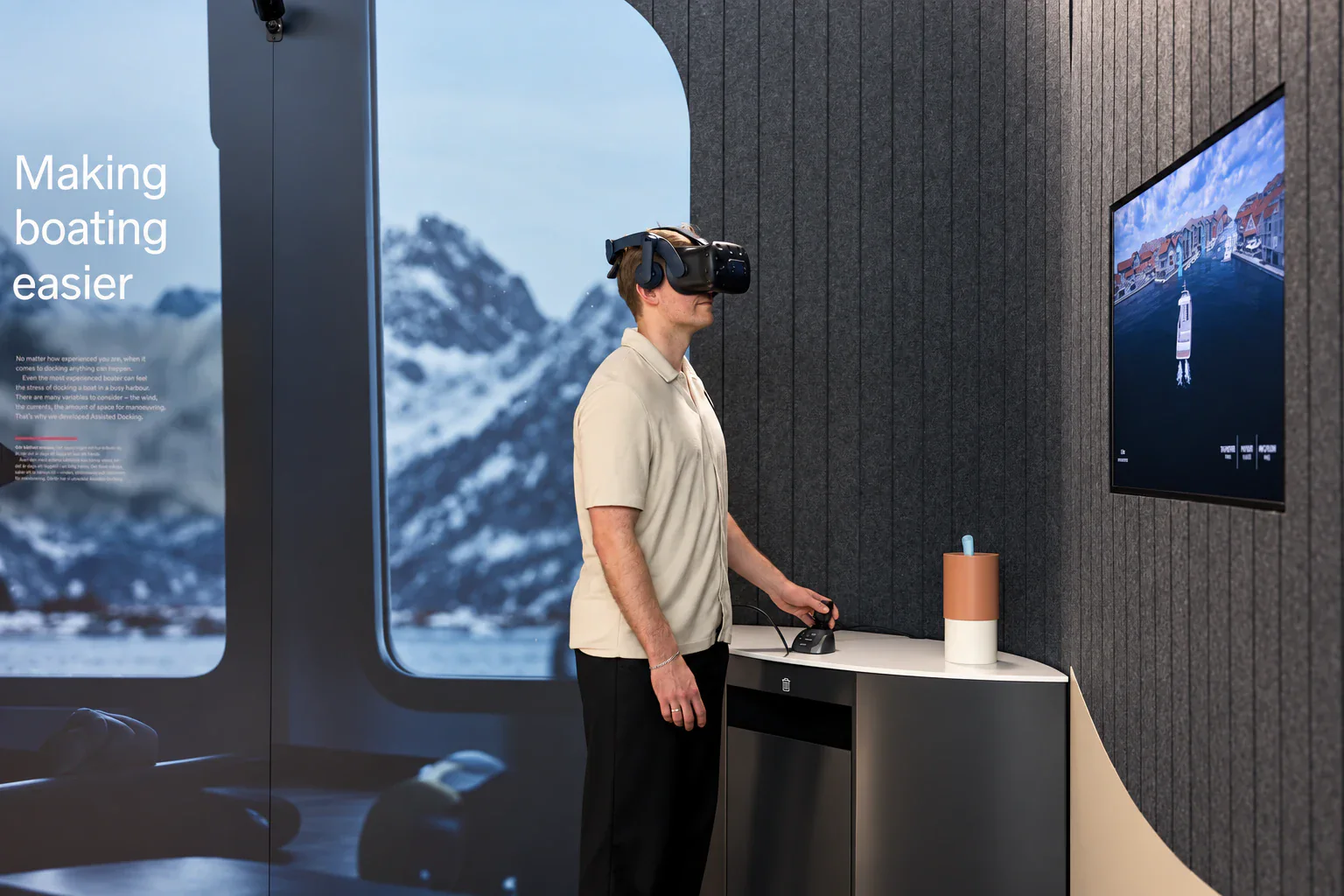 A visitor trying Volvo Penta Assisted Docking in virtual reality at World of Volvo